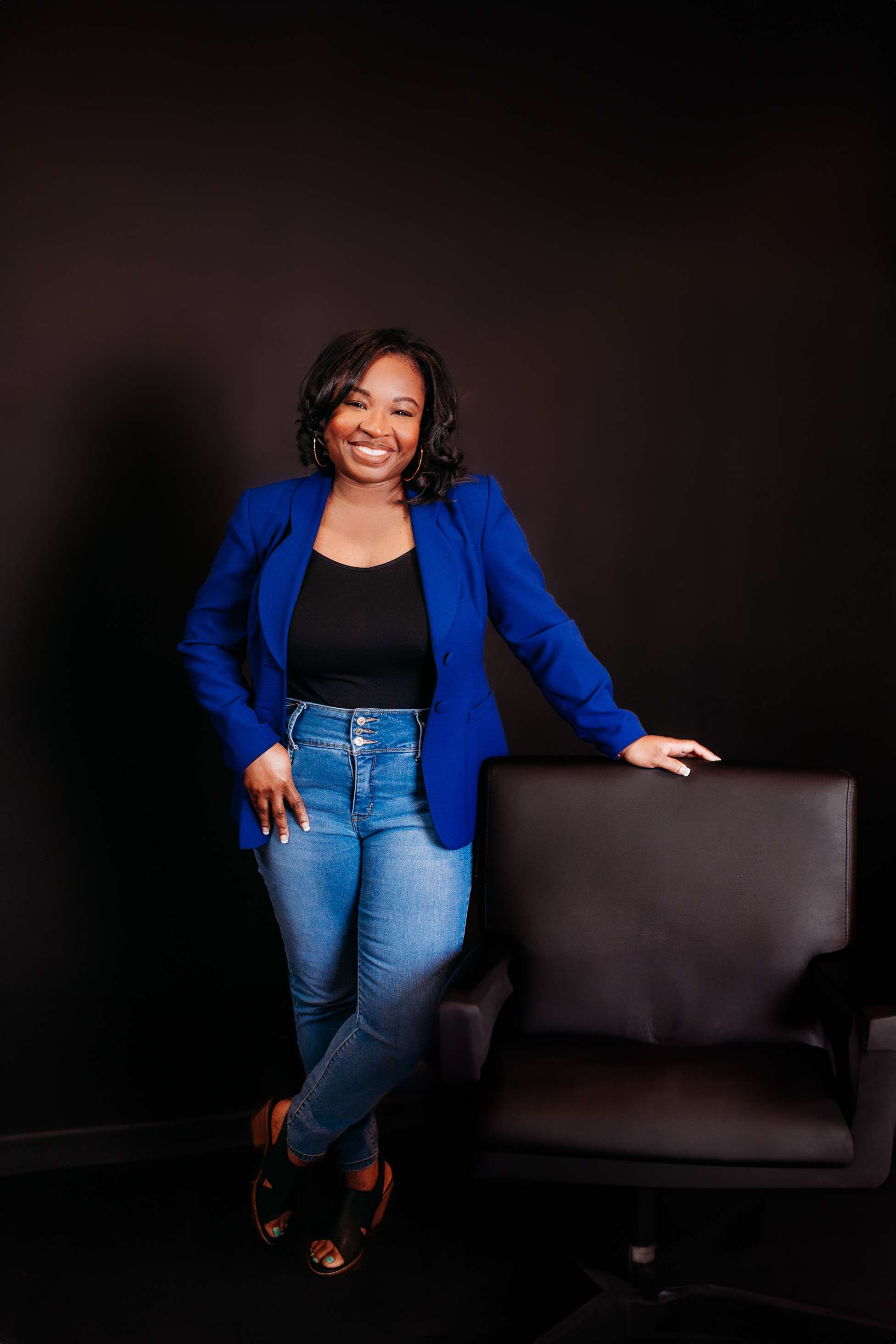 Teneille Standing in Blue Jacket